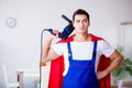 The superhero repairman with tools in repair concept Royalty Free Stock Photo