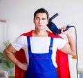 Superhero repairman with tools in repair concept Royalty Free Stock Photo