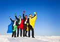 Superhero Team Arms Raised in Winter Royalty Free Stock Photo