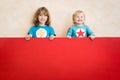 Superheroes children holding red banner blank