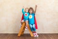 Superheroes children playing at home