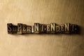 SUPERINTENDENT - close-up of grungy vintage typeset word on metal backdrop