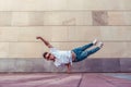 Superman flight, man acrobat dancer, handstand, dancing breakdance, summer city, free space text, hip hop dancer. Youth Royalty Free Stock Photo