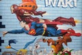 Superman, graffiti wall mural comic book, flea market, St. Ouen Clignancourt in Paris Royalty Free Stock Photo