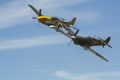 A Supermarine Spitfire and North American P-51 Mustang flying in tandem