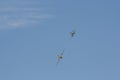 A Supermarine Spitfire and North American P-51 Mustang flying in tandem