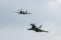 Supermarine Spitfire from the Royal Air Force RAF Battle of Britain Memorial Flight BBMF leads a RAF Eurofighter Typhoon FGR4 Royalty Free Stock Photo