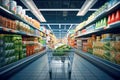 Supermarket aisle with shelves full of food products. Blurred background Royalty Free Stock Photo