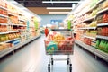 Supermarket aisle with shelves full of food products. Blurred background Royalty Free Stock Photo