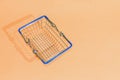 Supermarket basket close-up on textured paper background Royalty Free Stock Photo