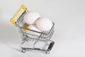 A supermarket cart and eggs, a close-up