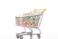 Supermarket cart full of colorful drugs. Drug, pills, medicine addiction Royalty Free Stock Photo