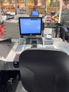 Supermarket cashier counter with no worker and Pause text on the display