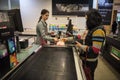 Women at supermarket check-out