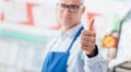 Supermarket clerk giving a thumbs up Royalty Free Stock Photo