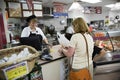 supermarket employees in a supermarket selling sandwiches and sweets to tourists in Hurricane, USA