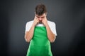 Supermarket employer standing with fingers on head like thinking Royalty Free Stock Photo