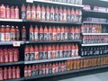 Supermarket fully stocked with bottled fruit juice.