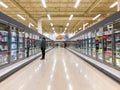 Supermarket - Grocery store with frozen food section aisle - Editorial image Royalty Free Stock Photo