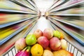 Supermarket interior, filled with fruit of shopping cart. Royalty Free Stock Photo