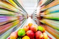 Supermarket interior, filled with fruit of shopping cart. Royalty Free Stock Photo