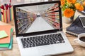 Supermarket online shopping. Blur supermarket on a laptop screen, office desk