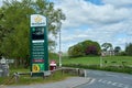 Supermarket petrol/gas prices and store facilities sign