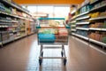 Supermarket scene with a conveniently placed shopping cart for context Royalty Free Stock Photo