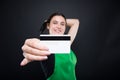 Supermarket seller holding her credit card in closeup