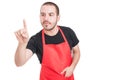 Supermarket seller pointing on modern touchscreen