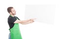 Supermarket seller showing and holding big advertising board