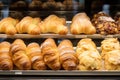 Supermarket shelf displaying an assortment of bakery products Royalty Free Stock Photo