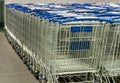 Supermarket shopping carts lined up empty Royalty Free Stock Photo