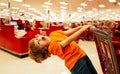 Supermarket, Shopping with Child. Healthy lifestyle for young family with kids. Cute toddler boy in a food store or a Royalty Free Stock Photo