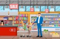 Supermarket store interior with goods. Royalty Free Stock Photo