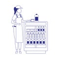 Supermarket woman worker next to beverages fridge
