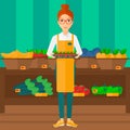 Supermarket worker with box full of apples. Royalty Free Stock Photo