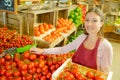 Supermarket worker by vegetables