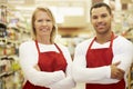 Supermarket Workers Standing In Grocery Aisle Royalty Free Stock Photo