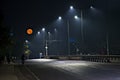 Supermoon image with empty street early in the morning Royalty Free Stock Photo