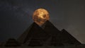 Supermoon over the great pyramids, Cairo, Egypt. Timelapse.