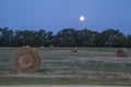 Supermoon over hay bales Royalty Free Stock Photo