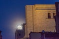 Supermoon over the rooftops of the old town of Girona, Catalonia