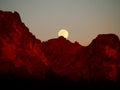 The Strawberry Supermoon Rising over the Superstition Mountains at Sunset Royalty Free Stock Photo