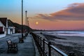 Supermoon setting from Saltburn-by-the-sea. Royalty Free Stock Photo