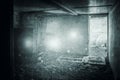 A supernatural concept of floating orbs of light. In a ruined building. With a grunge, texture edit