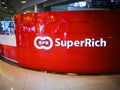 Superrich international money exchange, image shows trademark logo on its front counter branch in a shopping center.