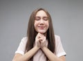 Superstitious teenager girl hoping her wishes will come true, having excited happy look