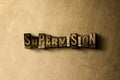 SUPERVISION - close-up of grungy vintage typeset word on metal backdrop