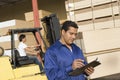 Supervisor And Forklift Truck Driver Royalty Free Stock Photo